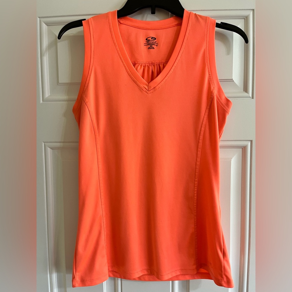 Champion Women’s size medium orange exercise top loose fit.